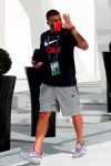 PSG's Kylian Mbappe gestures to fans as he leaves the team hotel for a training session in Lisbon, Friday Aug. 21, 2020. PSG will play Bayern in the Champions League final on Sunday. (AP Photo/Armando Franca)
