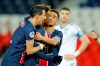PSG's Timothee Pembele, 2nd left, celebrates with Angel Di Maria, left, after scoring the opening goal during the French League One soccer match between Paris Saint-Germain and Strasbourg at the Parc des Princes in Paris, France, Wednesday, Dec. 23, 2020. (AP Photo/Christophe Ena)