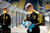 Ball boys disinfect the footballs before the German Bundesliga soccer match between Borussia Dortmund and Schalke 04 in Dortmund, Germany, Saturday, May 16, 2020. The German Bundesliga becomes the world's first major soccer league to resume after a two-month suspension because of the coronavirus pandemic. (AP Photo/Martin Meissner, Pool)