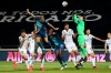 Famalicao goalkeeper Rafael Defendi, center right, jumps for the ball with Porto's Pepe, center left, during the Portuguese League soccer match between FC Famalicao and FC Porto in Famalicao, Portugal, Wednesday, June 3, 2020. The Portuguese League soccer matches resumed Wednesday without spectators because of the coronavirus pandemic. (Jose Coelho/Pool via AP)