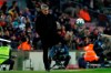 Barcelona's head coach Quique Setien kicks the ball back to the pitch during a Spanish La Liga soccer match between Barcelona and Granada at Camp Nou stadium in Barcelona, Spain, Sunday, Jan. 19, 2020. (AP Photo/Joan Monfort)
