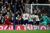 Liverpool's Roberto Firmino, left, scores the opening goal during the English Premier League soccer match between Tottenham Hotspur and Liverpool at the Tottenham Hotspur Stadium in London, England, Saturday, Jan. 11, 2020. (AP Photo/Matt Dunham)