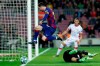 Barcelona's Lionel Messi leaps over Mallorca's goalkeeper Manolo Reina, on the ground, during a Spanish La Liga soccer match between Barcelona and Mallorca at Camp Nou stadium in Barcelona, Spain, Saturday, Dec. 7, 2019. (AP Photo/Joan Monfort)