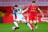 Atalanta's Papu Gomez controls the ball ahead of Liverpool's James Milner, right, during the Champions League group D soccer match between Liverpool and Atalanta at Anfield stadium in Liverpool, England, Wednesday, Nov. 25, 2020. (Laurence Griffiths/Pool via AP)