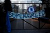 A banner hangs from one of the gates of Stamford Bridge stadium in London where Chelsea fans were protesting against Chelsea's decision to be included amongst the clubs attempting to form a new European Super League, Tuesday, April 20, 2021. Reaction to the proposals from 12 clubs to rip up European soccer by forming a breakaway Super League has ranged from anger and condemnation to humor and sarcasm. (AP Photo/Matt Dunham)