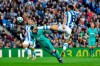 Real Sociedad's Mikel Merino, right, leaps to block a header from Barcelona's Lionel Messi during the Spanish La Liga soccer match between Real Sociedad and Barcelona, at Anoeta stadium, in San Sebastian, Spain, Saturday, Dec. 14, 2019. (AP Photo/Alvaro Barrientos)