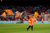 A steward collects a ball with the message 