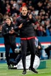 PSG's head coach Thomas Tuchel gestures, with Lyon's head coach Rudi Garcia in the background, during the League One soccer match between Paris Saint Germain and Lyon at the Parc des Princes stadium in Paris, Sunday, Feb. 9, 2020. (AP Photo/Thibault Camus)