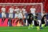 Sevilla players leap to block a free kick from Krasnodar's Kristoffer Olsson, 3rd right, during the Champions League group E soccer match between Sevilla FC and FC Krasnodar, at the Ramon Sanchez Pizjuan stadium in Seville, Spain, Wednesday, Nov. 4, 2020. (AP Photo/Miguel Morenatti)