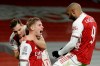 Arsenal's Emile Smith Rowe celebrates with Cedric Soares, left, and Alexandre Lacazette, right, after scoring the opening goal during the English FA Cup third round soccer match between Arsenal and Newcastle United at the Emirates Stadium in London, England, Saturday, Jan. 9, 2020. (AP Photo/Matt Dunham)