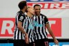 Newcastle's Dwight Gayle celebrates with Joelinton, left, and Callum Wilson, right, after scoring his side's second goal during the English Premier League soccer match between Newcastle United and West Bromwich Albion at St. James' Park in Newcastle, England, Saturday, Dec. 12, 2020. (Richard Sellers/ Pool via AP)