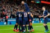 PSG players celebrate after Edinson Cavani scored their fourth goal during the League One soccer match between Paris Saint Germain and Lyon at the Parc des Princes stadium in Paris, Sunday, Feb. 9, 2020. (AP Photo/Thibault Camus)