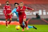 Manchester City's Ilkay Gundogan fouls Liverpool's Thiago, foreground, during the English Premier League soccer match between Liverpool and Manchester City at Anfield Stadium, Liverpool, England, Sunday, Feb. 7, 2021. (Tim Keeton/Pool via AP)