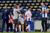 Porto former goalkeeper Iker Casillas, center with hat, celebrates with the players on the pitch at the end of the Portuguese League soccer match between FC Porto and Sporting CP at the Dragao stadium in Porto, Portugal, Wednesday, July 15, 2020. Porto defeated Sporting 2-0 to clinch the championship with two rounds left to play. (AP Photo/Luis Vieira)
