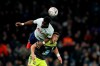 Tottenham's Tanguy Ndombele heads the ball above Southampton's Jan Bednarek, right, during the English FA Cup fourth round replay soccer match between Tottenham Hotspur and Southampton at the Tottenham Hotspur Stadium in London, Wednesday, Feb. 5, 2020. (AP Photo/Kirsty Wigglesworth)