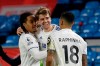 Leeds United's Patrick Bamford, center, celebrates after scoring the opening goal during the English Premier League soccer match between Leeds United and Southampton at Elland Road in Leeds, England, Tuesday, Feb. 23, 2021. (Gareth Copley/Pool via AP)