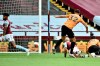 Wolverhampton Wanderers' Leander Dendoncker, center, scores the opening goal during the English Premier League soccer match between Aston Villa and Wolverhampton Wanderers at Villa Park in Birmingham, England, Saturday, June 27, 2020. (AP photo/Rui Vieira, Pool)