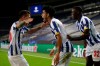 Porto's Luis Diaz celebrates with Otavio, left, and Malang Sarr, right, after scoring his side's third goal during the Champions League group C soccer match between FC Porto and Olympique de Marseille at the Dragao stadium in Porto, Portugal, Tuesday, Nov. 3, 2020. (AP Photo/Luis Vieira)