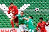 Bayern's Robert Lewandowski, left, heads the ball above Bremen's Niklas Moisander during the German Bundesliga soccer match between Werder Bremen and Bayern Munich in Bremen, Germany, Saturday, March 13, 2021. (AP Photo/Martin Meissner, Pool)