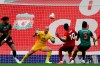 Liverpool's Sadio Mane, 2nd right, scores the opening goal during the English Premier League soccer match between Liverpool and Aston Villa at Anfield Stadium in Liverpool, England, Sunday, July 5, 2020. (Carl Recine/Pool via AP)