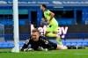 Everton's goalkeeper Jordan Pickford reacts after Newcastle's Callum Wilson, in the background scored the opening goal during the English Premier League soccer match between Everton and Newcastle United at Goodison Park, Liverpool, England, Saturday, Jan. 30, 2021. (Paul Ellis/Pool via AP)
