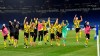 Dortmund players celebrate at the end of the German Bundesliga soccer match between FC Schalke 04 and Borussia Dortmund in Gelsenkirchen, Germany, Saturday, Feb. 20, 2021. Dortmund won 4-0. (AP Photo/Martin Meissner, Pool)