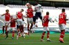 Tottenham's Toby Alderweireld, background center, scores his side's second goal during the English Premier League soccer match between Tottenham Hotspur and Arsenal at the Tottenham Hotspur Stadium in London, England, Sunday, July 12, 2020. (Tim Goode/Pool via AP)