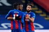 Crystal Palace's Jordan Ayew celebrates with Wilfried Zaha, left, and Andros Townsend, right, after scoring his side's fourth goal during the English Premier League soccer match between Crystal Palace and Leeds United at the Selhurst Park stadium in London, England, Saturday, Nov. 7, 2020. (Glyn Kirk/Pool via AP)