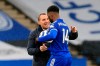 Leicester's manager Brendan Rodgers shakes hands with Leicester's Kelechi Iheanacho at the end of the English Premier League soccer match between Leicester City and Sheffield United at the King Power Stadium in Leicester, England, Sunday, March 14, 2021. Iheanacho scored a hat trick in Leicester's 5-0 win. (Lindsey Parnaby/Pool via AP)