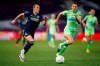 Lyon's Lucy Bronze, left, runs with the ball followed by Wolfsburg's Dominique Janssen during the Women's Champions League final soccer match between Wolfsburg and Lyon at the Anoeta stadium in San Sebastian, Spain, Sunday, Aug. 30, 2020. (Clive Brunskill/Pool via AP)