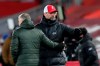 Liverpool's manager Jurgen Klopp, right, and Manchester United's manager Ole Gunnar Solskjaer greet each other at the end of the English Premier League soccer match between Liverpool and Manchester United at Anfield Stadium, Liverpool, England, Sunday, Jan. 17, 2021.(Michael Regan/Pool via AP)