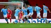 Manchester City's Phil Foden, center, celebrates after scoring his side's fourth goal during the English Premier League soccer match between Liverpool and Manchester City at Anfield Stadium, Liverpool, England, Sunday, Feb. 7, 2021. (Laurence Griffiths/Pool via AP)