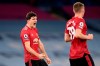 Manchester United's Harry Maguire celebrates at the final whistle during the English Premier League soccer match between Manchester City and Manchester United at the Etihad Stadium in Manchester, England, Sunday, March 7, 2021. Manchester United won 2-0. (Laurence Griffiths/Pool via AP)