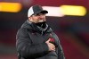 Liverpool's manager Jurgen Klopp gestures to the fans at the end of the English Premier League soccer match between Liverpool and Wolverhampton Wanderers at Anfield Stadium, Liverpool, England, Sunday, Dec. 6, 2020. Liverpool won 4-0. (Peter Powell/Pool via AP)