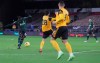 Tottenham's Tanguy Ndombele, left, shoots and scores the opening goal of the game during the English Premier League soccer match between Wolverhampton Wanderers and Tottenham Hotspur at Molineux Stadium, in Woverhampton, England, Sunday, Dec. 27, 2020. (Carl Recine/ Pool via AP)