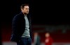 Chelsea's head coach Frank Lampard watches his player warm up ahead of the English Premier League soccer match between Arsenal and Chelsea at the Emirates stadium in London, Saturday, Dec. 26, 2020. (Adrian Dennis/ Pool via AP)