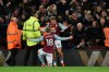 Aston Villa's Matt Targett, (18) is congratulated by teammate Aston Villa's Jack Grealish after scoring the opening goal of the game during the English League Cup semifinal 2nd leg soccer match between Aston Villa and Leicester City and at the Villa'Park in Birmingham, England, Tuesday, Jan. 28, 2020. (AP Photo/Rui Vieira)