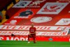 Liverpool's Fabinho takes a knee just prior to the start of the English Premier League soccer match between Liverpool and Chelsea at Anfield Stadium in Liverpool, England, Wednesday, July 22, 2020. (Phil Noble/Pool via AP)