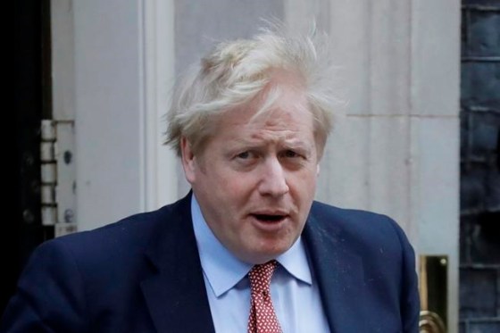 Britain's Prime Minister Boris Johnson leaves 10 Downing Street for the House of Commons for his weekly Prime Ministers Questions, in London, Wednesday, March 25, 2020. British lawmakers will vote later Wednesday to shut down Parliament for 4 weeks, due to the coronavirus outbreak. The new coronavirus causes mild or moderate symptoms for most people, but for some, especially older adults and people with existing health problems, it can cause more severe illness or death.(AP Photo/Matt Dunham)