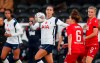Tottenham Hotspur's Alex Morgan, center, vies for the ball with Reading's Angharad James during the English Women's Super League soccer match between Tottenham Hotspur and Reading at the Hive stadium in London Saturday, Nov. 7, 2020. Morgan came on as a 69th minute substitute, the game ended in a 1-1 draw. (AP Photo/Alastair Grant)