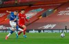 Everton's Richarlison, left , left, shoots and scores the opening goal of the game as Liverpool's Ozan Kabak, attempts to defend during the English Premier League soccer match between Liverpool and Everton at Anfield in Liverpool, England, Saturday, Feb. 20, 2021. (Paul Ellis / Pool via AP)