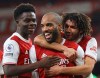 Arsenal's Alexandre Lacazette, centre, celebrates after scoring the opening goal of the game from the penalty spot during their English Premier League soccer match between Arsenal and Chelsea at the Emirates stadium in London, Saturday, Dec. 26, 2020. (Julian Finney Pool via AP)