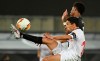 Sevilla's Jesus Navas, left. clears the ball under pressure from Manchester United's Marcus Rashford during the Europa League semifinal soccer match between Sevilla and Manchester United in Cologne, Germany, Sunday, Aug. 16, 2020. (Ina Fassbender/Pool Via AP)