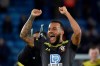 Southampton's Ryan Bertrand celebrates towards his teams fans after the end of the English Premier League soccer match between Leicester City and Southampton at the King Power stadium in Leicester, England Saturday, Jan. 11, 2020. Southampton won the game 2-1, having been beaten in the reverse fixture 9-0. (AP Photo/Rui Vieira)