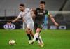 Sevilla's Munir El Haddadi, left and Manchester United's Harry Maguire vie for the ball during the Europa League semifinal soccer match between Sevilla and Manchester United in Cologne, Germany, Sunday, Aug. 16, 2020. (Ina Fassbender/Pool Via AP)