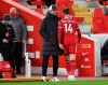 Liverpool's Jordan Henderson is hugged by Liverpool's manager Jurgen Klopp as he is substituted after an injury during the English Premier League soccer match between Liverpool and Everton at Anfield in Liverpool, England, Saturday, Feb. 20, 2021. (Paul Ellis / Pool via AP)