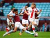 Aston Villa's Tyrone Mings, left slides in to tackle Southampton's Stuart Armstrong during the English Premier League soccer match between Aston Villa and Southampton at Villa Park in Birmingham, England, Sunday, Nov. 1, 2020. Southampton won the game 4-3. (Michael Steele/Pool via AP)