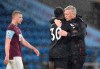West Ham's manager David Moyes, right, hugs West Ham's Michail Antonio on the pitch after the end of the English Premier League soccer match between Burnley and West Ham United and at Turf Moor stadium in Burnley, England, Monday, May 3, 2021. West Ham won the game 2-1 with West Ham's Michail Antonio scoring both of their goals. (AP Photo/Peter Powell/Pool via AP)