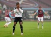 Fulham's Ademola Lookman reacts after missing a penalty and failing to score during the English Premier League soccer match between West Ham United and Fulham at the London stadium in London, Saturday, Nov.7, 2020. (Cath Ivill/Pool via AP)