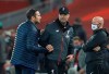 Chelsea's head coach Frank Lampard, left shakes hands with Liverpool's manager Jurgen Klopp after the end of the English Premier League soccer match between Liverpool and Chelsea at Anfield Stadium in Liverpool, England, Wednesday, July 22, 2020. Liverpool won the game 5-3. (Phil Noble/Pool via AP)